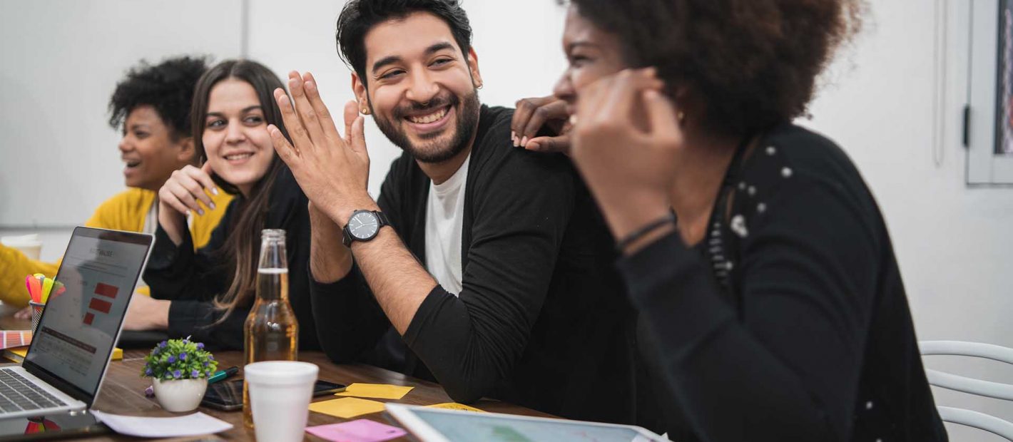 Group of multiethnic creative business people working on a project and having a brainstorming meeting. Team work and brainstorming concept.