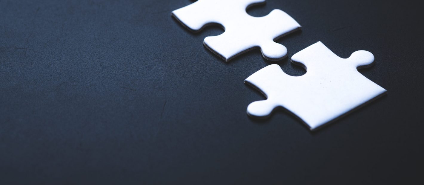 Two pieces of jigsaw puzzle or autism puzzle piece symbol, business partner concept