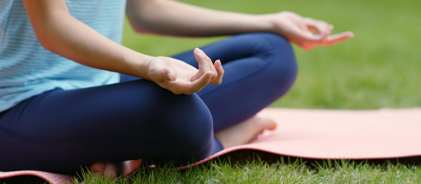 Woman do yoga at the park